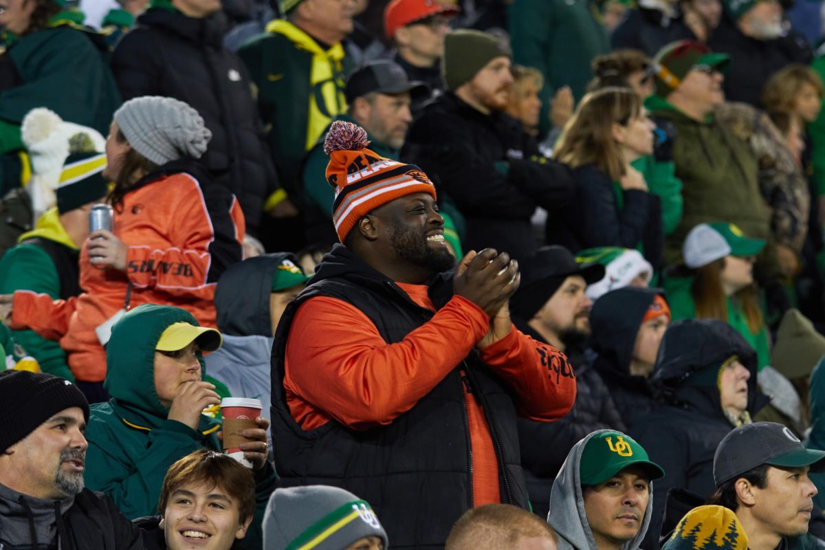 An Oregon State University football fan
cheers for his team at the football game between the University of Oregon and Oregon State University at Autzen Stadium on November 24. This game held lots of emotions as the rivalry between the two teams is strong.