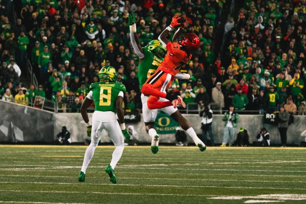 Silas Bolden high-points a pass for a catch against the University of Oregon at Autzen Stadium in Eugene on Nov. 24.