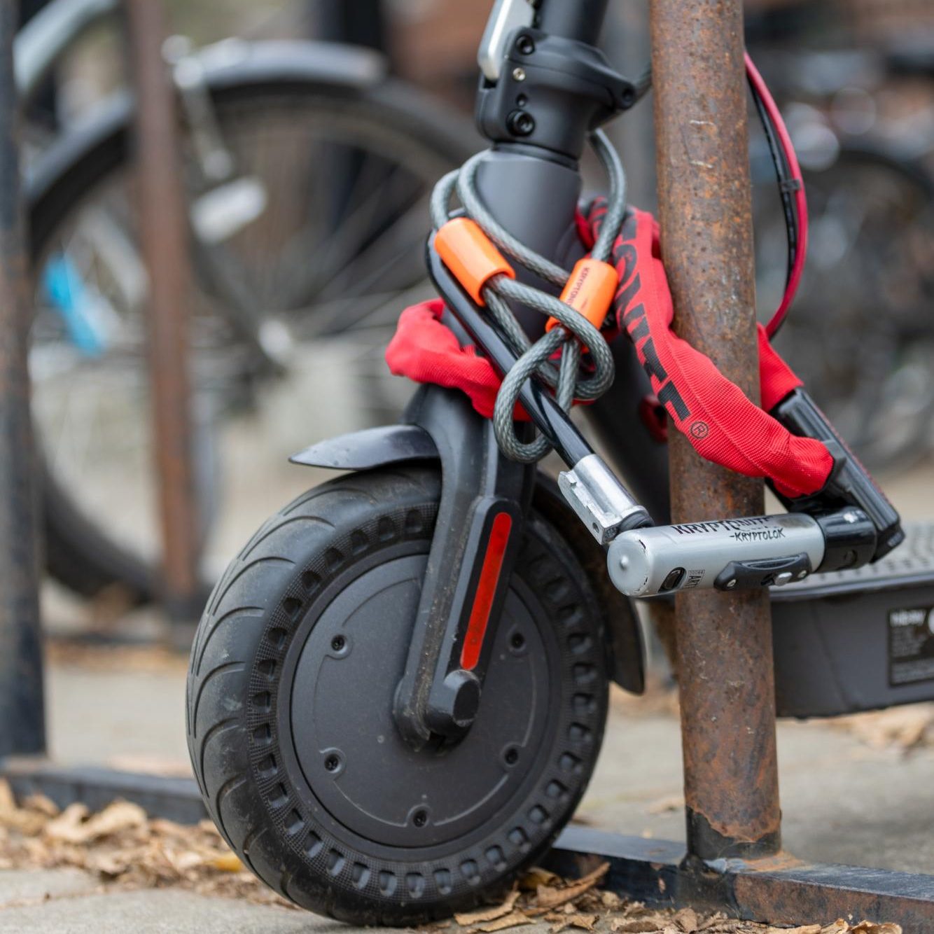 An electric scooter at a bike rack on the Oregon State University campus.