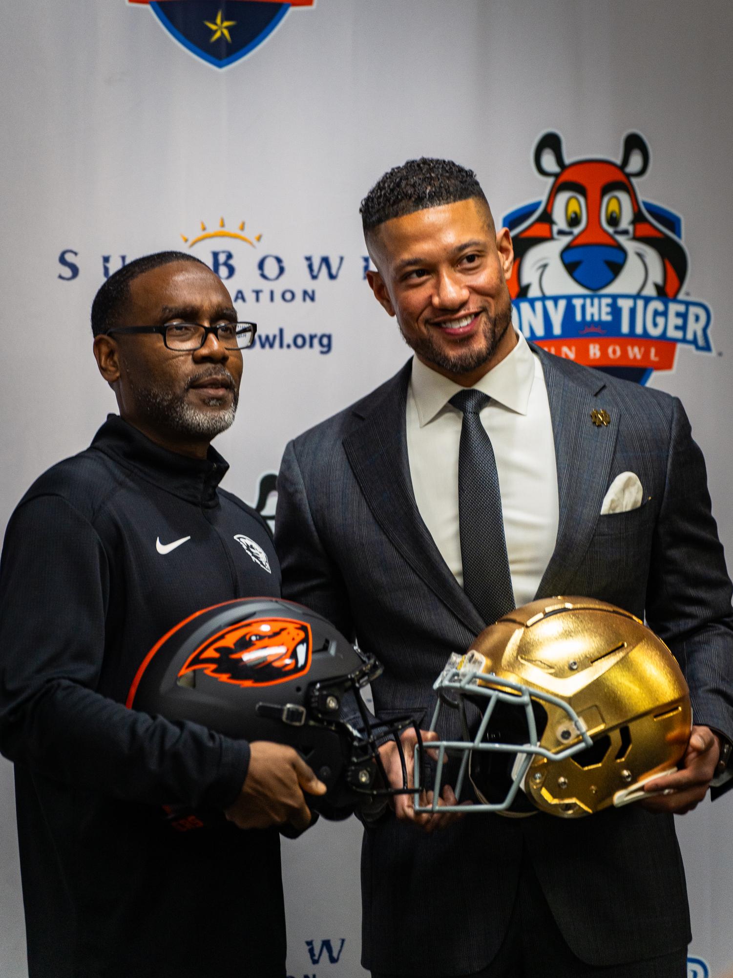 Oregon State interim head coach Kefense Hynson (left) and Notre Dame head coach Marcus Freeman pose together at the Tony the Tiger Sun Bowl Press Conference in El Paso, Texas on Dec 28, 2023. 
