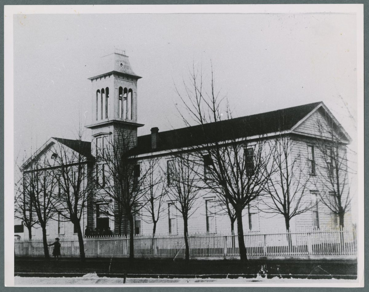 The original Corvallis College building, photographed in 1880. The building, located in the same block as the current Corvallis City Hall, was used for both classes and church meetings.