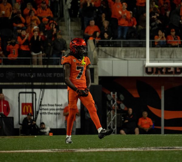 OSU Wide Receiver Silas Bolden celebrates after having gotten OSU’s offense within 20 yards of the goal line Friday night. Bolden received for 100 yards and one touchdown against Utah. 
