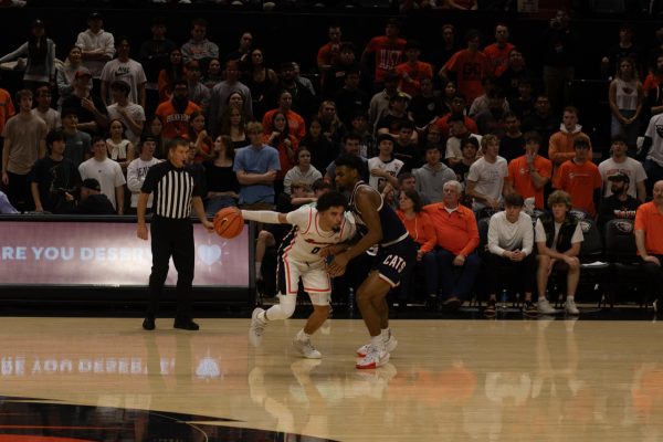 Oregon State guard Jordan Pope (0) drives as Arizona defends in a game where he scored 31 points and a game winner on Jan. 25, 2024