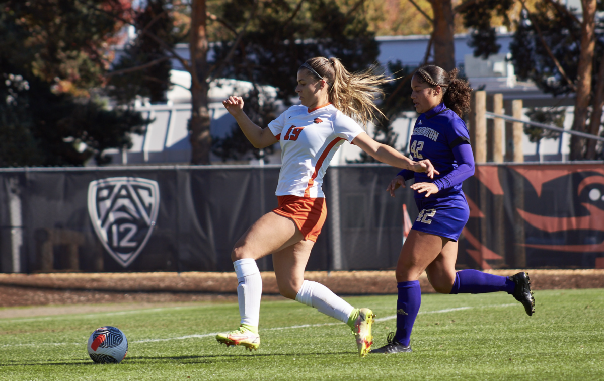 Oregon State Forward McKenna Martinez (#19) keeps the ball from Huskies defender Riley Brown (#42) in OSU’s game against UW on Paul Lorenz Field in Corvallis on Oct. 29, 2023.
