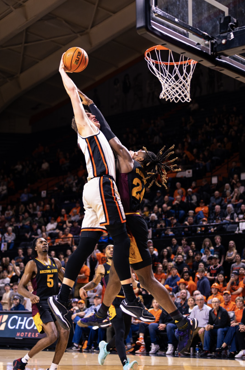 Tyler Bilodeau (34) goes up for a dunk on Arizona State opponent Bryant Selebangue at Gill Coliseum in Corvallis on Jan. 27.
