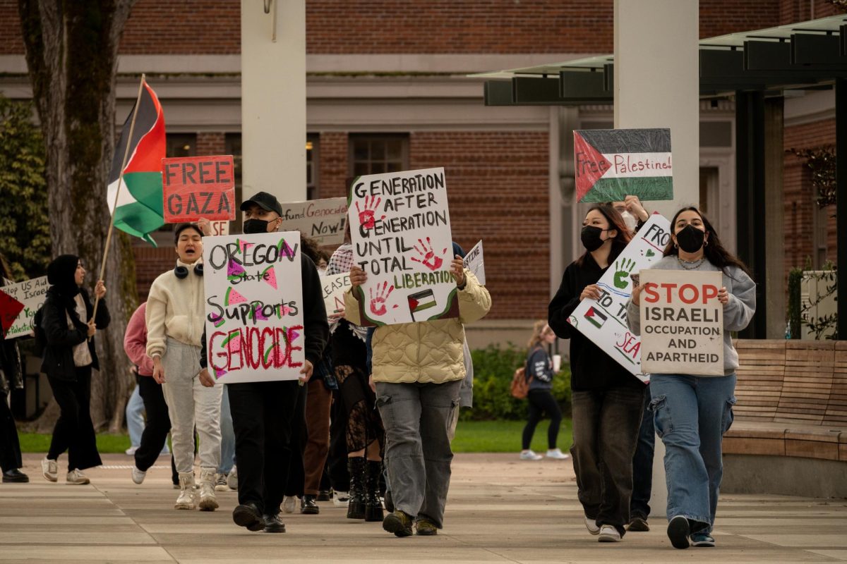 Oregon State University students and Corvallis residents gather in the Student
Experience Plaza on campus protesting against Israel on Thursday. Originally expected to be a
protest against planned Pro-Israeli spokespeople in a closed door event Thursday evening, the
event was canceled and the protest was moved to the afternoon.