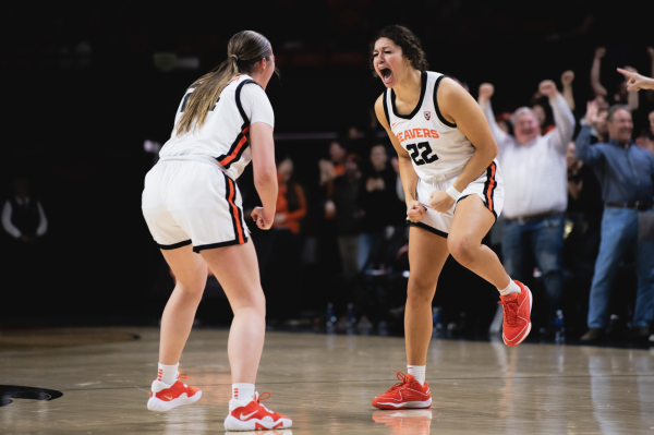 Talia Von Oelhoffen celebrates with Adlee Blacklock after hitting a 3 to send the game to overtime against the University of Arizona Wildcats at Gill Coliseum in Corvallis on Jan. 12. 
