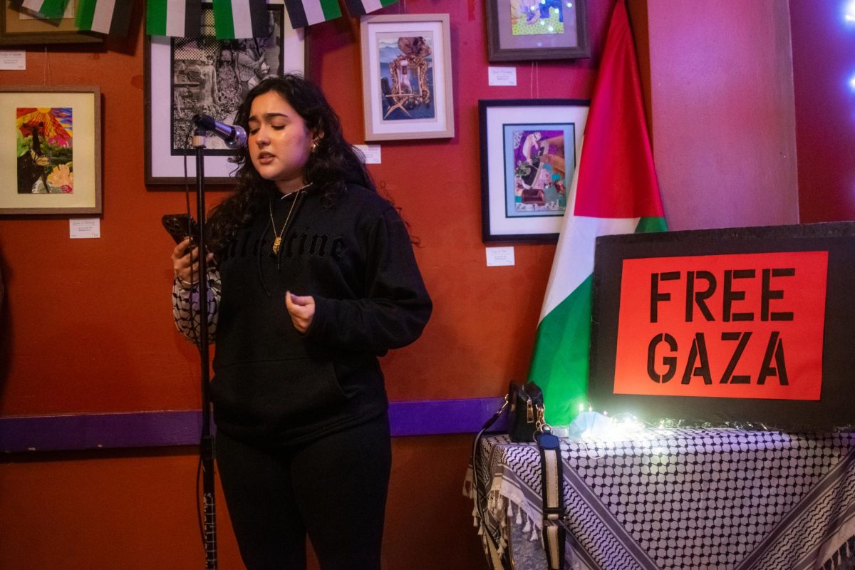 Heba B. recites a poem during Palestinian Poetry Night at Interzone Coffeehouse, Feb 23, 2024.
