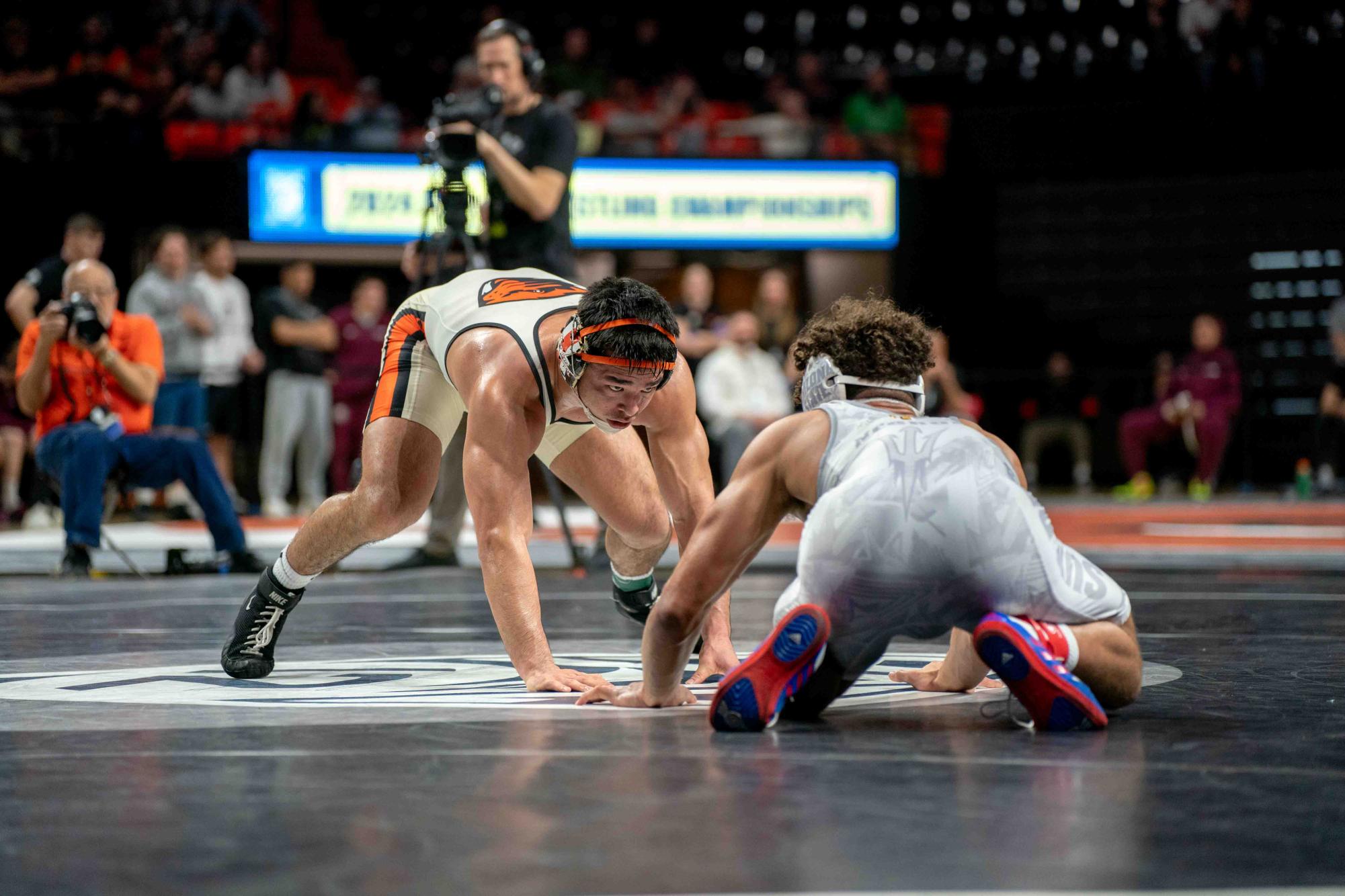 Trey Munoz stares down his opponent in the match to determine First Place for his weight class during the Pac-12 Wrestling Championship at Gill Coliseum in Corvallis on Sunday.