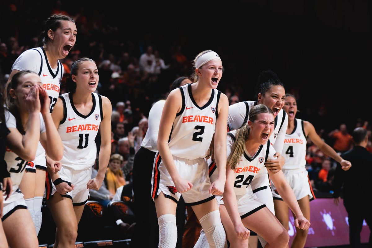 The Beaver’s bench celebrates a play against the University of Arizona at Gill Coliseum in Corvallis on Jan. 12.