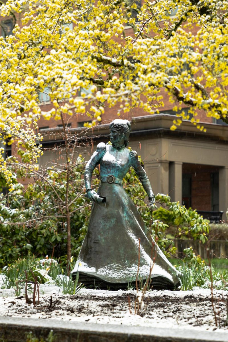 The snow-dusted statue of Alice Biddle stands outside Strand Agricultural Hall at Oregon State University in Corvallis on March 1, 2024.
