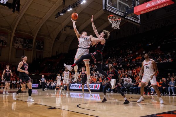 Oregon State Sophomore Tyler Bilodeau (34) takes a shot Thursday night against Utah. During the game, Bilodeau scored 20 points — the second most out of all OSU players that night.
