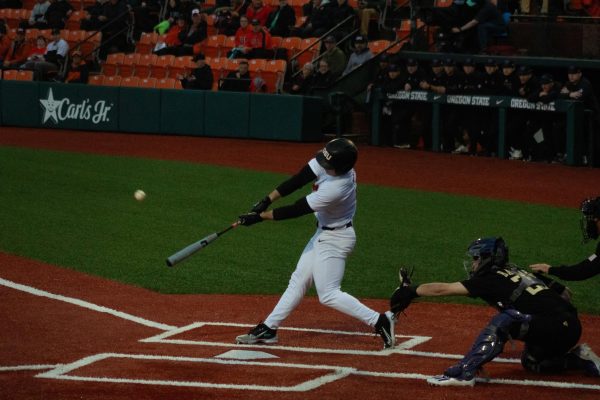 Left fielder Dallas Macias (#4) hits the ball in the Beavers’ game against the University of Washington on March 22, 2024 in Goss Stadium in Corvallis. 
