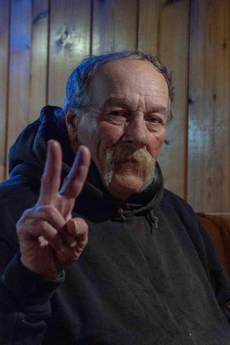 Jimmy is all smiles and throws up a peace sign at Peacock Bar and Grill in Corvallis OR on Mar 20 2024.