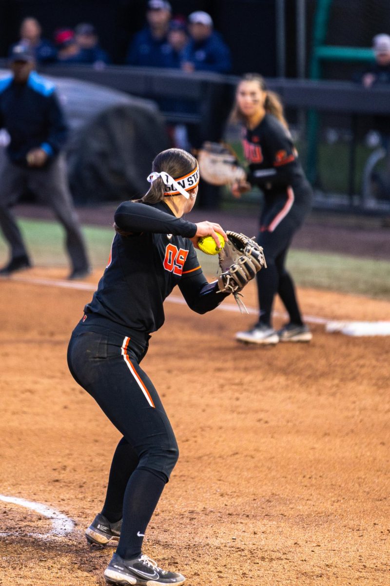 Sarah Haendiges (30) throws the ball to Lici Campbell (24) at first base, outting Arizona
at Kelly Field on March 9 in Corvallis, Oregon.