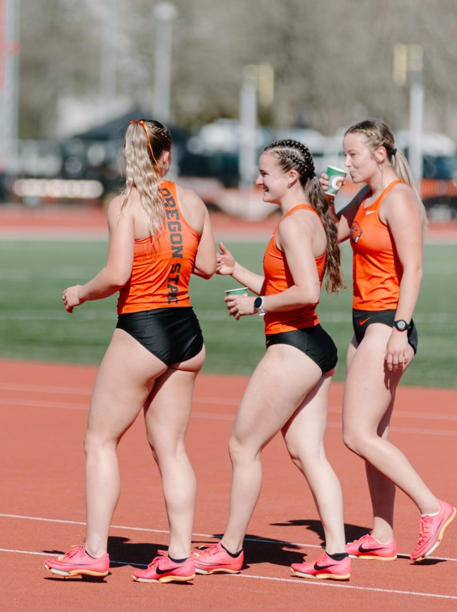 Jada Hurley (left) and Abby Buckley embrace after finishing first and second in the women’s 100 meter race at the OSU PNW Invite at Whyte Track on March 16, 2024. 