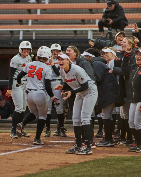 Oregon State University softball players cheer after teammate Madyson Clark hit a home run at Kelly Field on Friday April 26th.