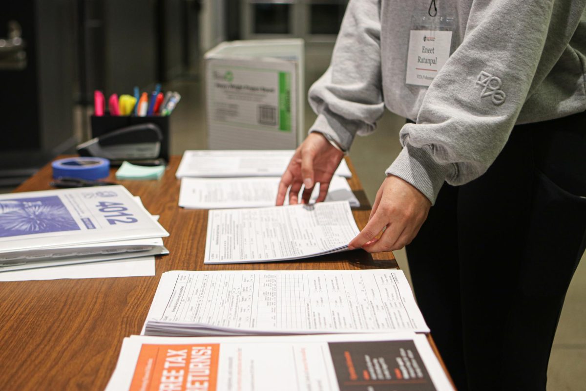 OSU’s VITA volunteer, Eneet Ratanpal, neatly stacks the tax forms at the Austin Hall Building in Oregon State University on Mar 7, 2024.
