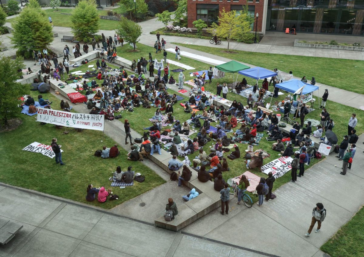 Corvallis community members gather to listen to a speaker for a protest in support of Palestine on OSU campus, in Corvallis, OR, on May 1, 2024. 