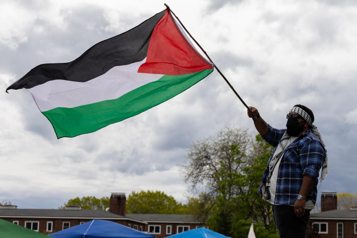 A Corvallis community member flies the Palestinian flag at a sit-in protest in support of Palestine on Oregon State campus in Corvallis on Wednesday, May 1. 