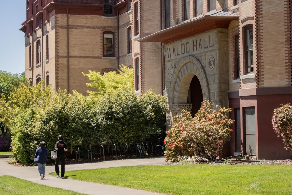 People walk outside the front of Waldo Hall at Oregon State University on May 5th.