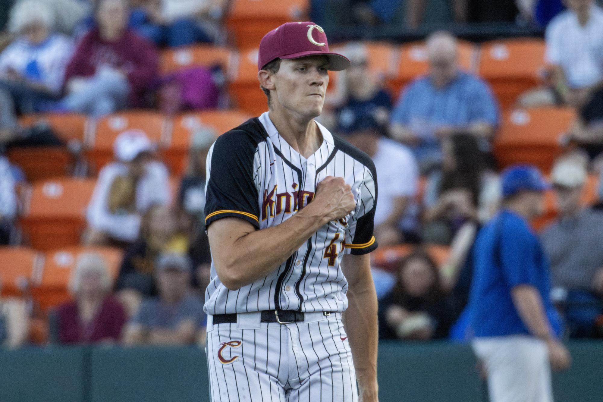 Number 41 Jonathan Stone pounds their chest after striking out a player on the Corvallis Marketmen on June 22 at Goss Stadium.