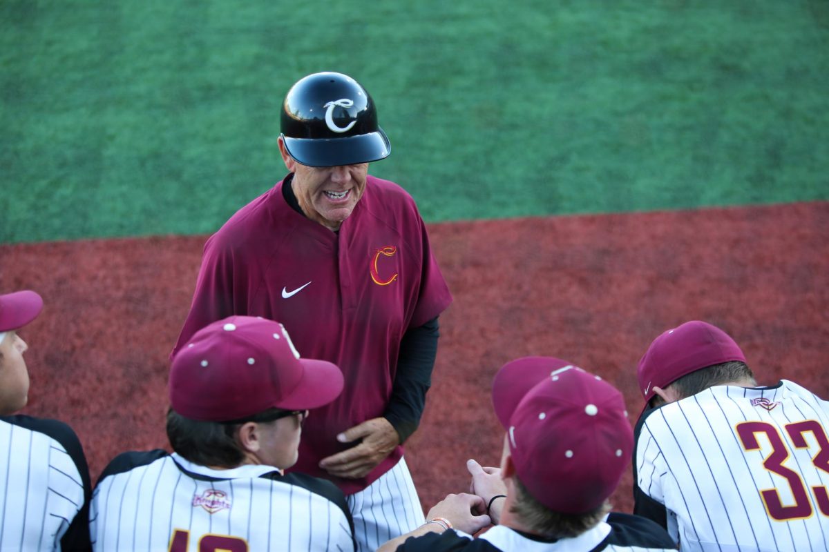 Ed Knaggs, Corvallis Knights associate head coach, speaks to several players during the Knights vs Drifters game on June 22. 
