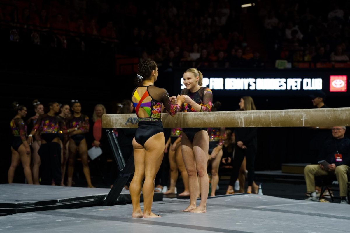Jade Carey gives Sophia Esposito a pep talk before she competes her beam routine at the Oregon State University v. Brown gymnastics meet at Gill Coliseum on January 21st, 2024. 