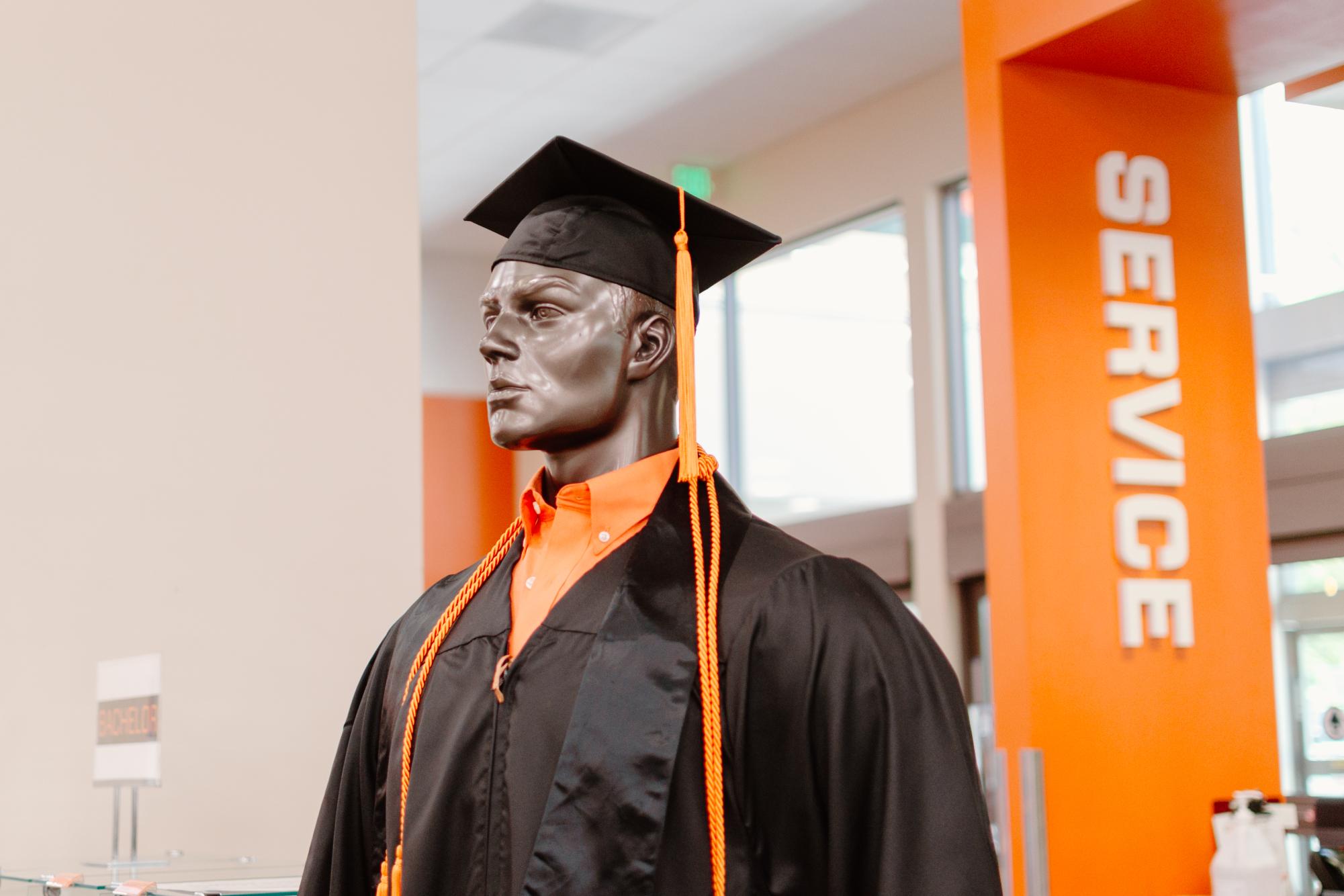 Stoles, tassels, and cords displayed at the Oregon State University Beaver Store on May 14, 2024.