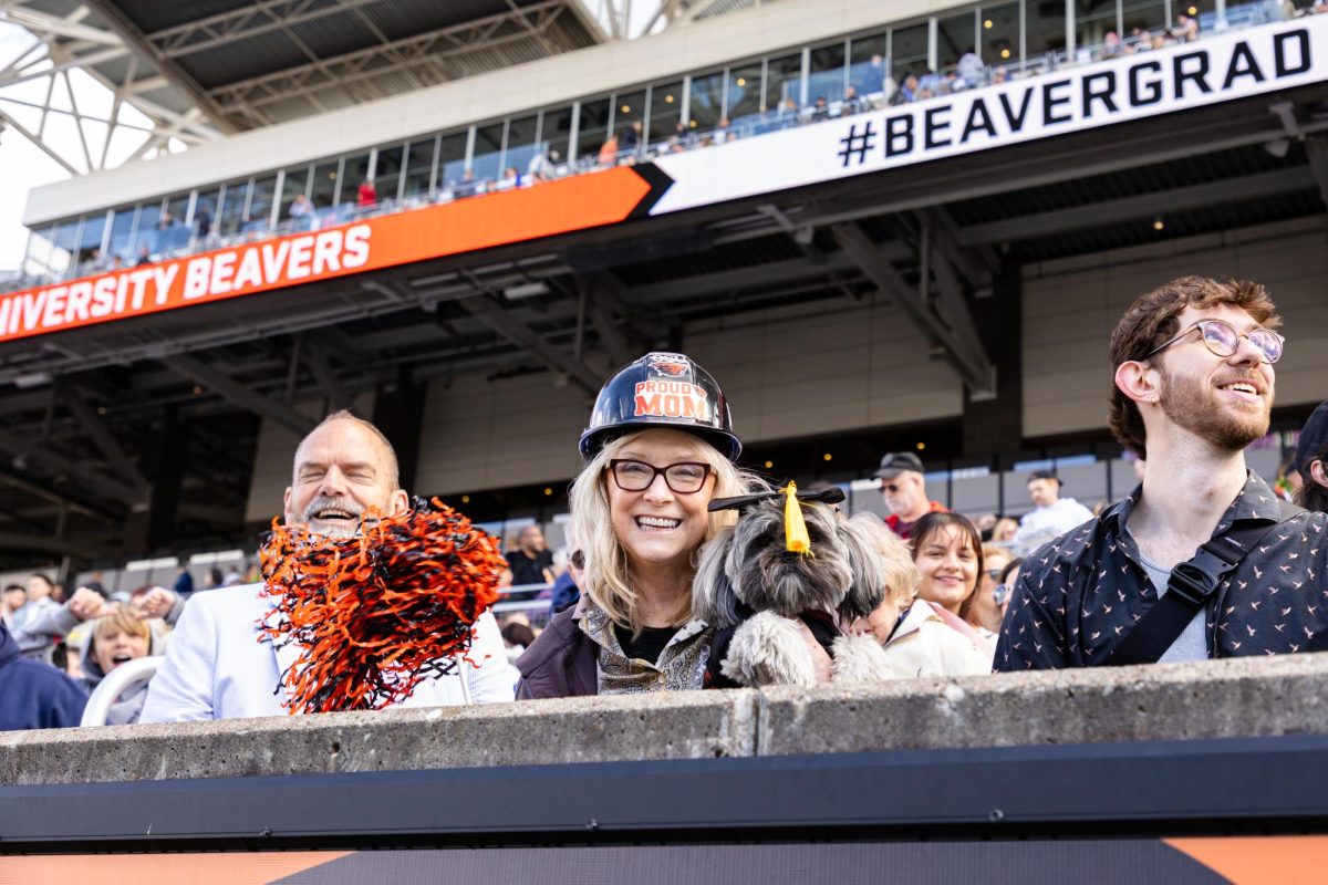 An audience member celebrates in the stands of Reser Stadium at the 155th Commencement ceremony on Jun 15, 2024 in Corvallis, Oregon.