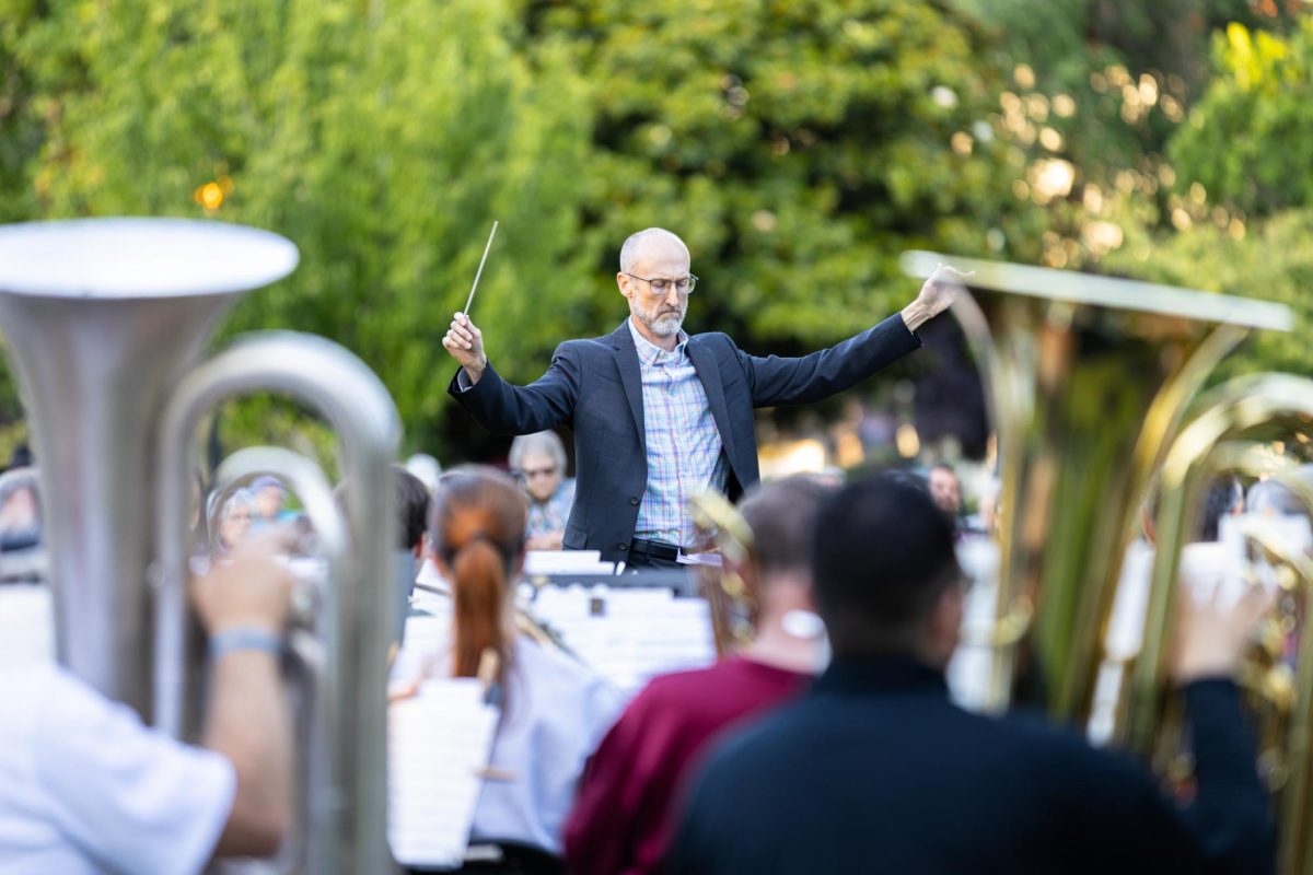 Justin Preece conducts “No Strings Attached”, the first of the Summer Concert Series at Central Park in Corvallis, Oregon on June 18.