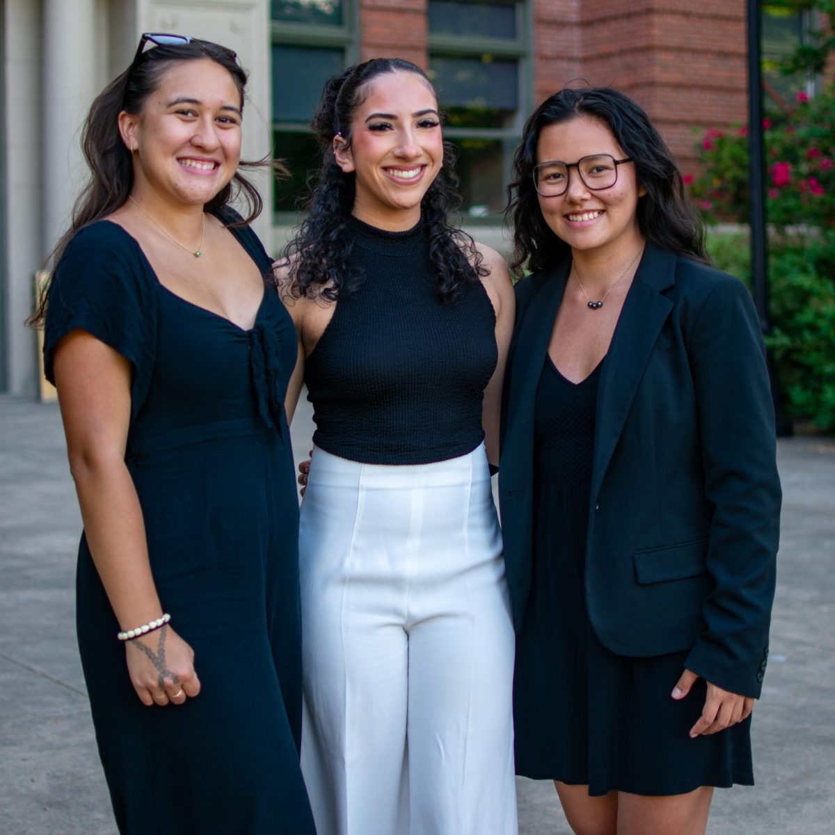 Tihani Mitchell (she/her), Giada Langhan (she/her), and Summer Wong (she/her) stand outside of Strand Agricultural Hall at Oregon State University in Corvallis, Oregon, May 19.