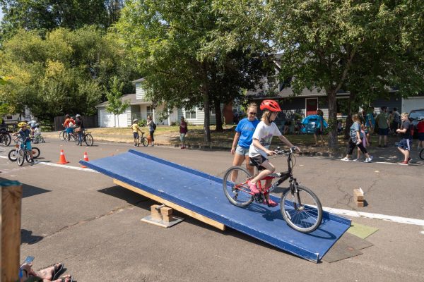 Kids take turns on the bike teeter totter at Open Streets Corvallis on July 21.
