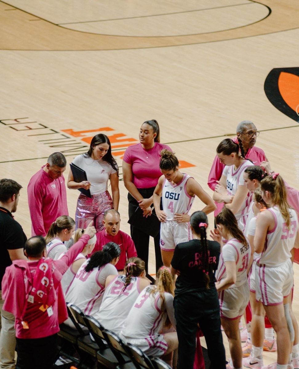 Beaver Women’s Basketball head coach Scott Rueck speaks to the team during a timeout in a game against the University of Southern California at Gill Coliseum in Corvallis on Feb. 18.