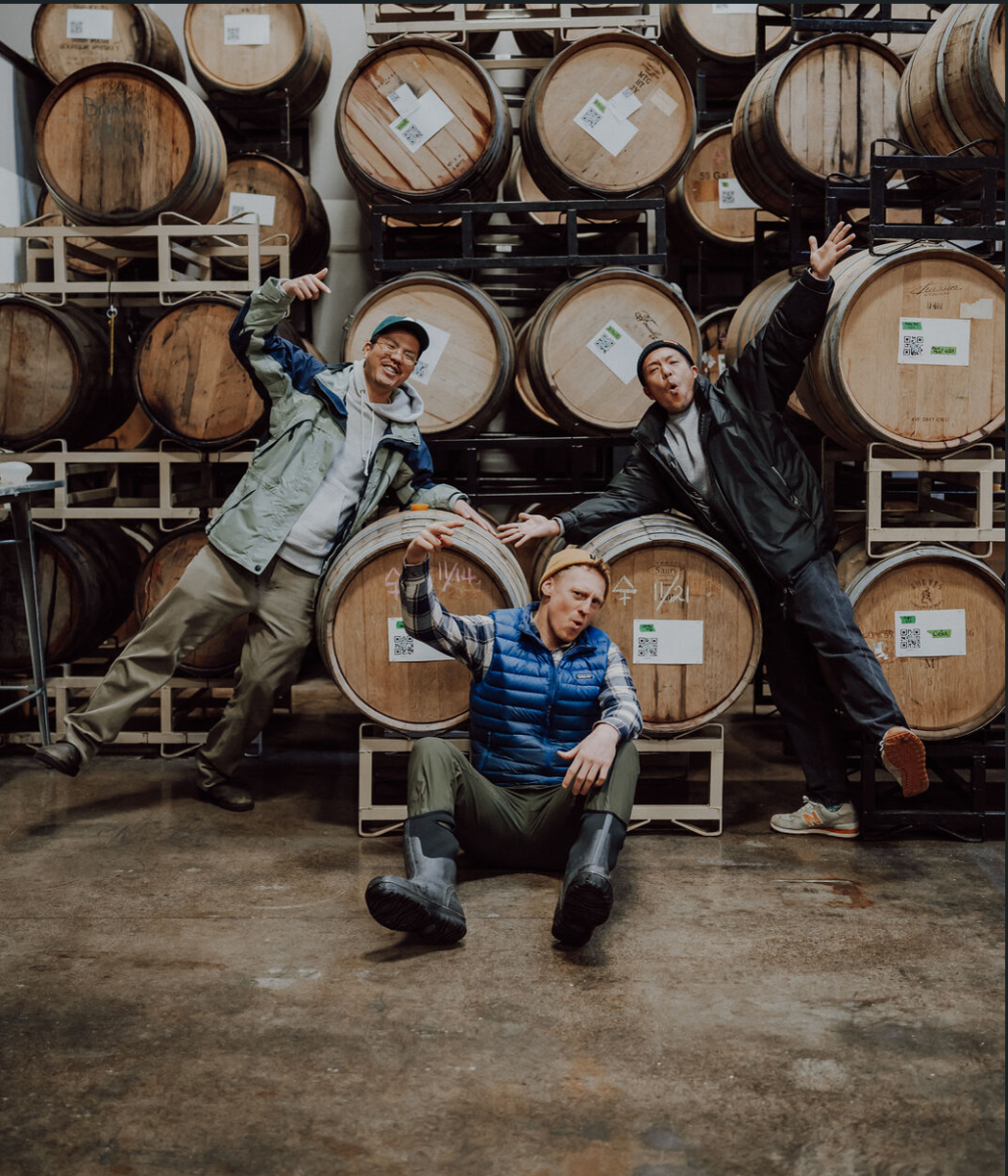 Photo contributed by 2 Towns media team: Kota Ozawa (right), Dave Takush (middle) and Takuro Ikeuchi
(left) pose in front of tap barrels.