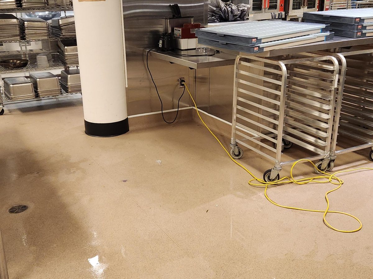 The floor of the Global Community Kitchen flooded due to someone hitting the sprinkler