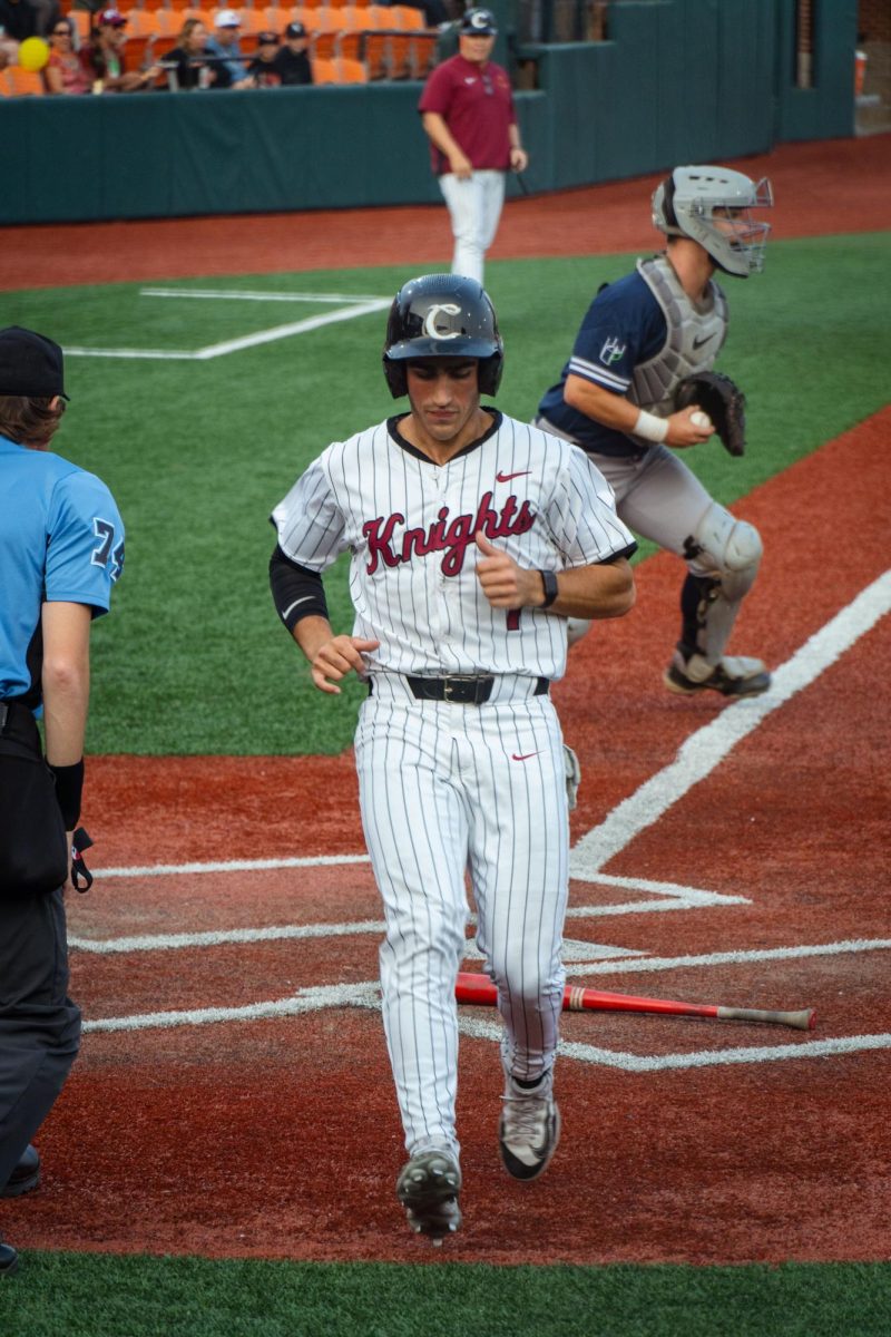Thomas Ferroggiaro runs home and scores against the Portland Pickles at Goss Stadium in Corvallis OR on July 27 2024. 