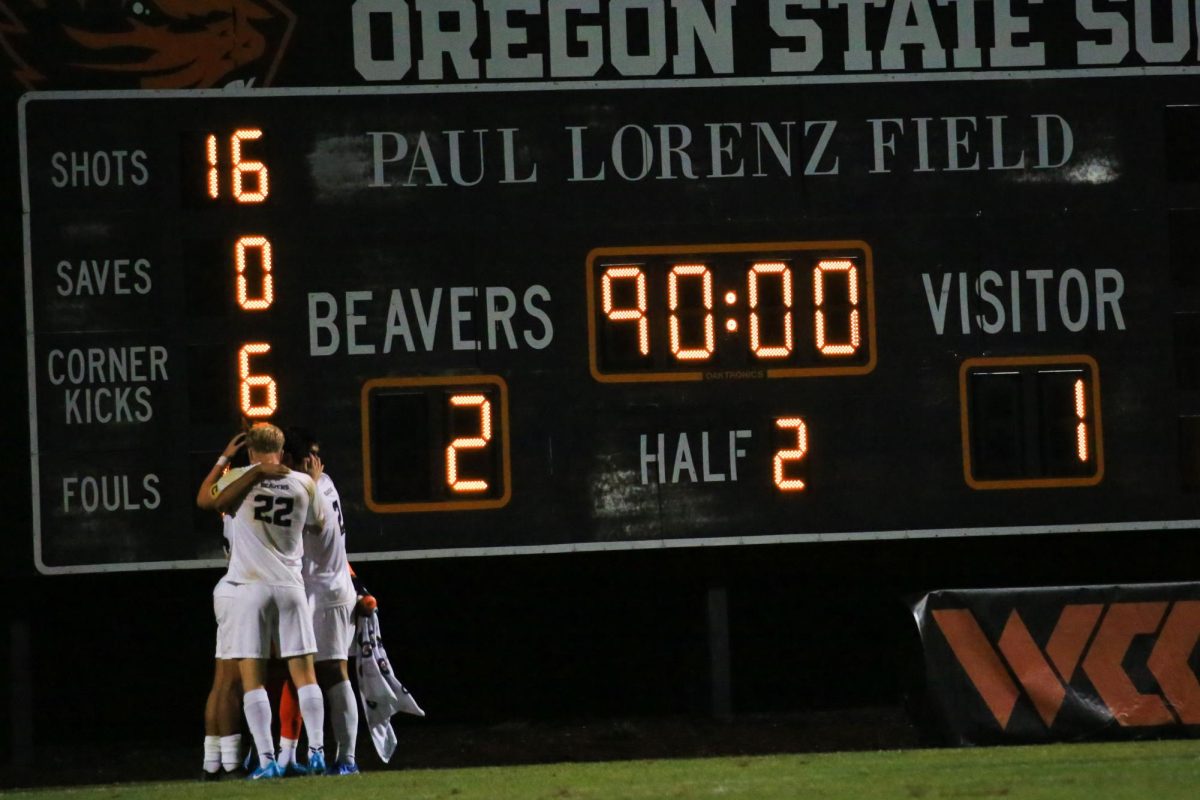 OSU Men’s soccer players hug after a win against UC Irvine on August 22. 