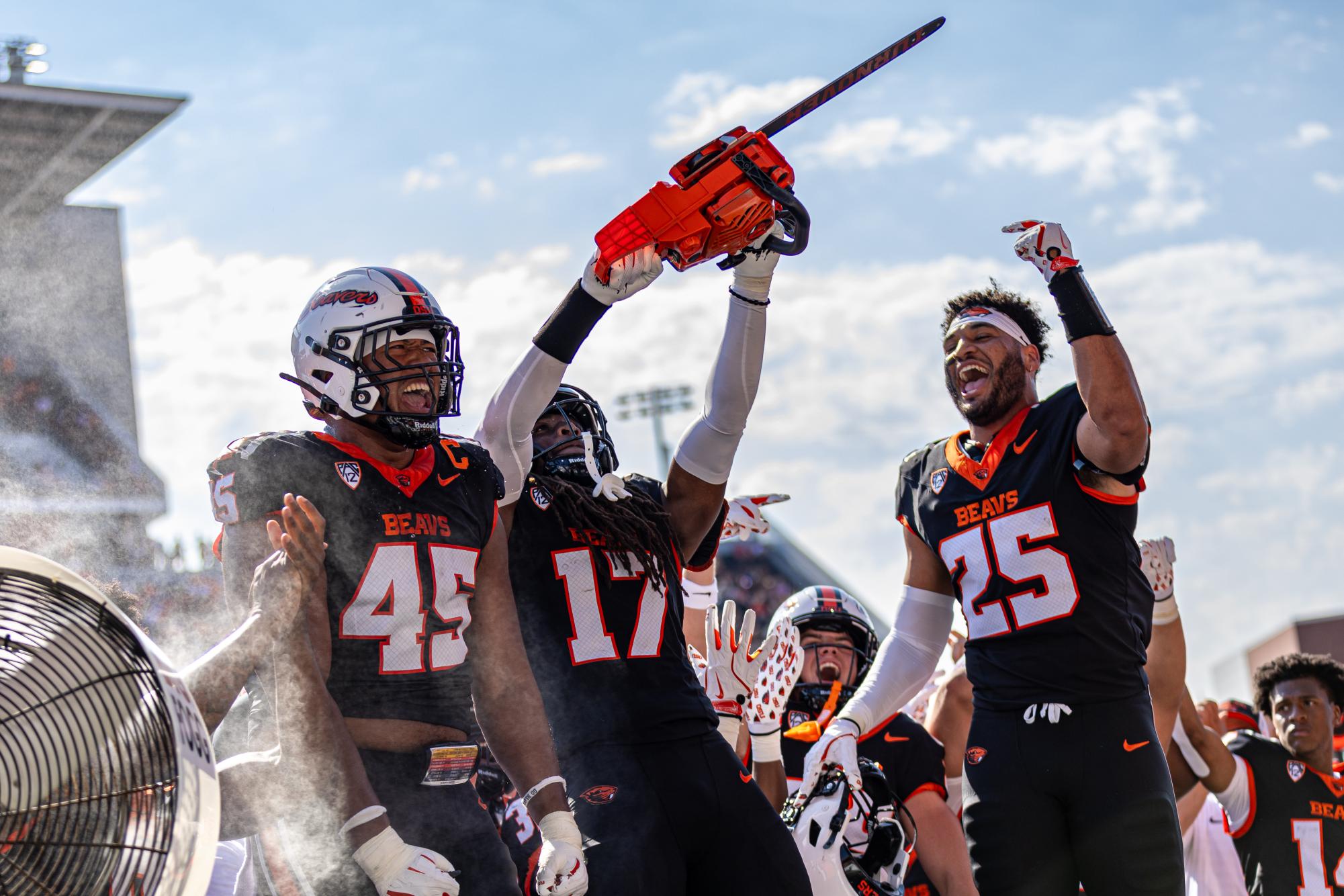 Skyler Thomas (17) celebrates with the famous turnover chainsaw after making an incredible interception on August 31st, the Beavers took on the Idaho State Bengals at Reser Stadium, the beavers fought hard, taking the first season win (38-15)