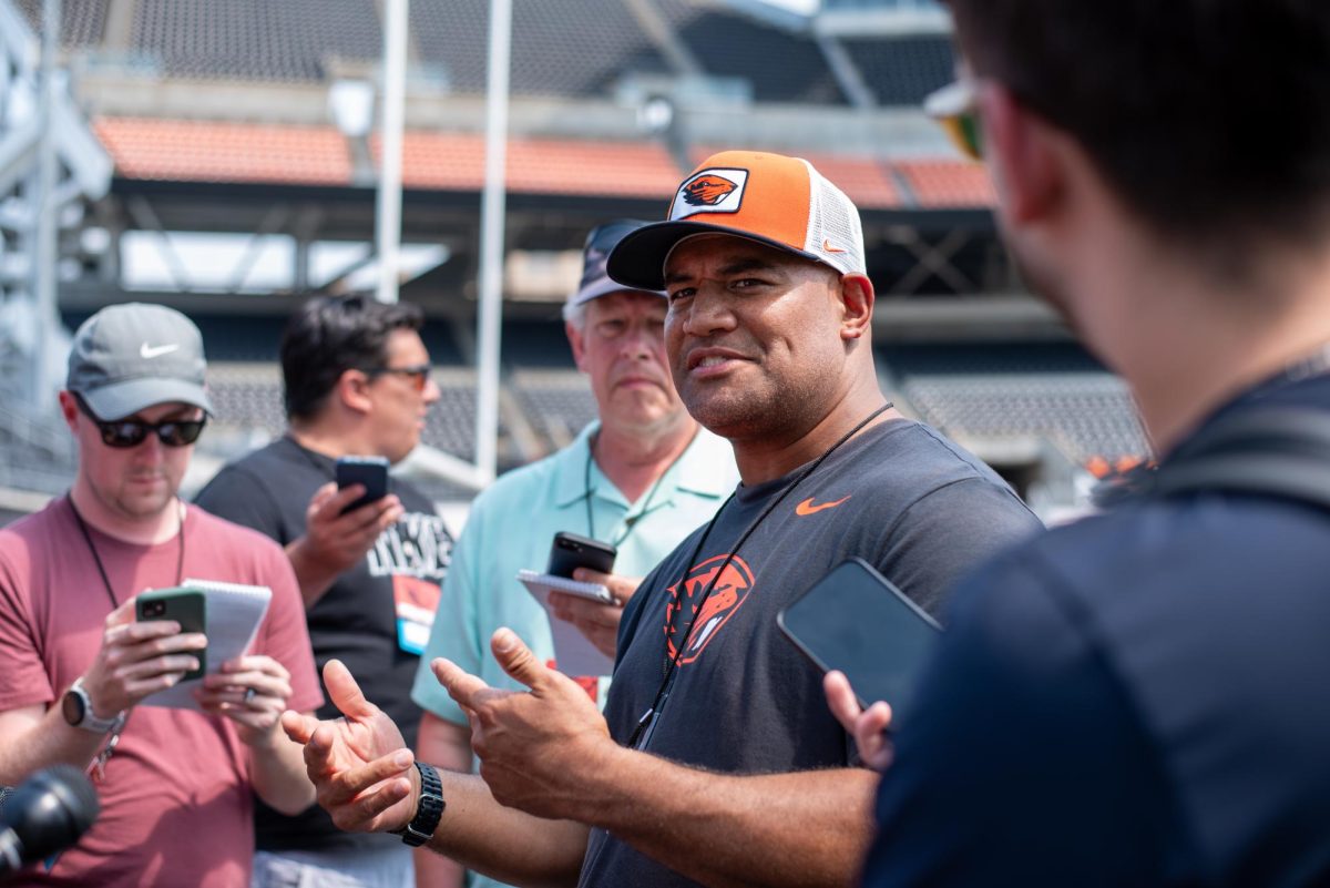 Defensive line coach Ilaisa Tuiaki is interviewed by the media after Fall Camp at Oregon State University’s Reser Stadium in Corvallis, Oregon, August 8.