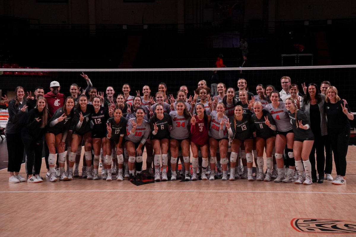 The Oregon State Beavers and Washington State Cougars pose together in Gill Coliseum on August 28 2023, signaling the schools standing together as the last two remaining of the Pac-12.