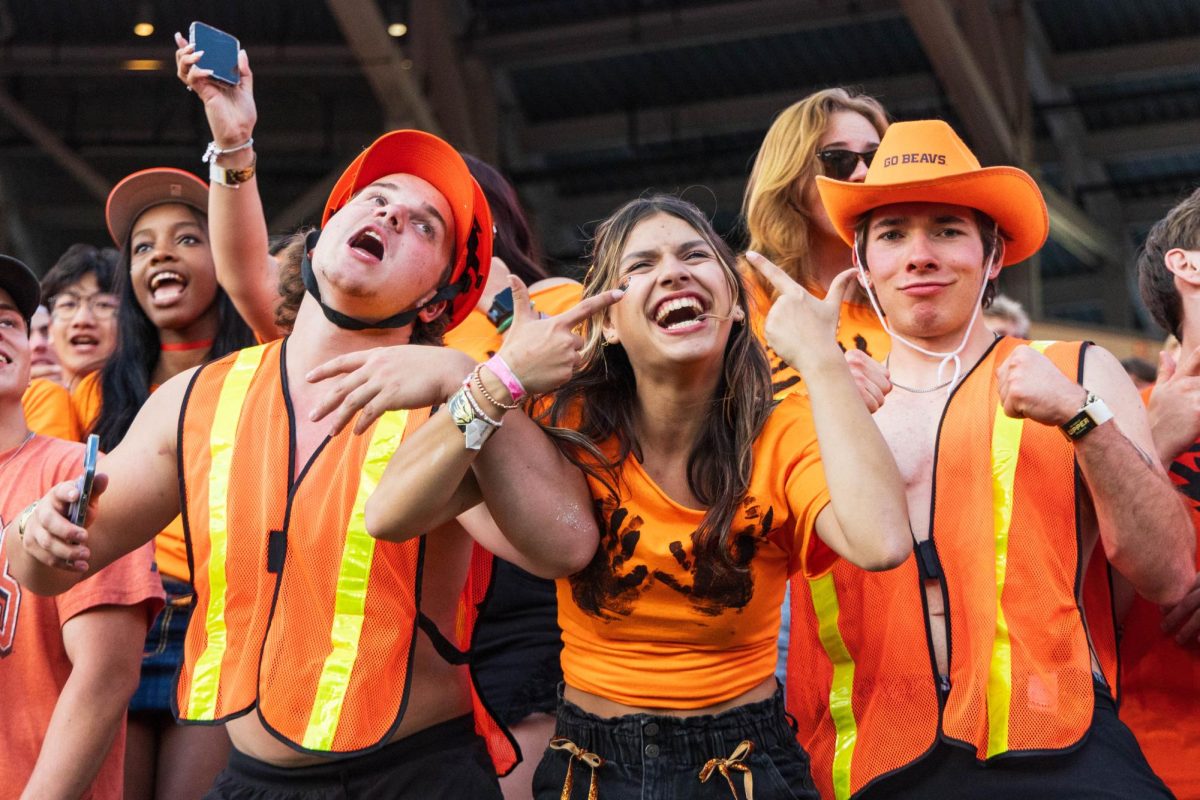 Beavers fans sing along to the Toyota Sing Along during the second quarter of OSU’s game against Purdue in Reser Stadium on Sept 21 in Corvallis.