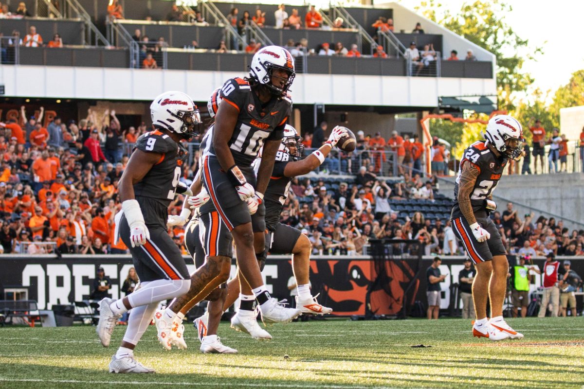 The Oregon State Beavers celebrate after a successful play in OSU’s game against Purdue in Reser Stadium on Sept 21 in Corvallis.