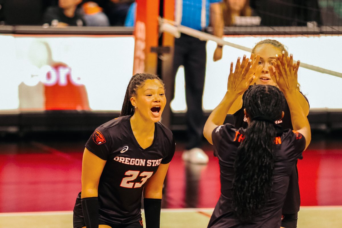 Oregon State's Alexis Rodriguez #23  celebrates with her teammates on the court after winning a point against Pepperdine at Gill Coliseum on September 26, 2024.