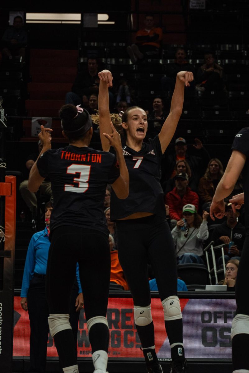 Amanda Burns and Zaria Thornton celebrate a point against Saint Marys in Gill Coliseum in Corvallis OR on Oct 24 2024.