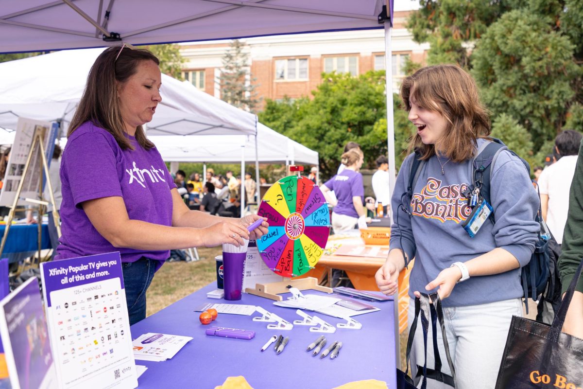 Dylan Kemper wins a highlighter at the Xfinity booth at the Beaver Community Fair on
Sept 27, 2024, at Oregon State University.