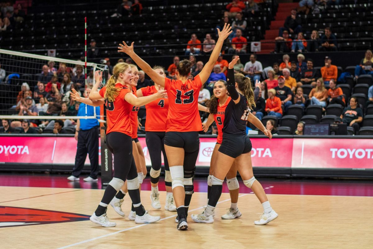 The Oregon State Beavers come together after winning a rally against Santa Clara University on October 10 in Gil Coliseum.