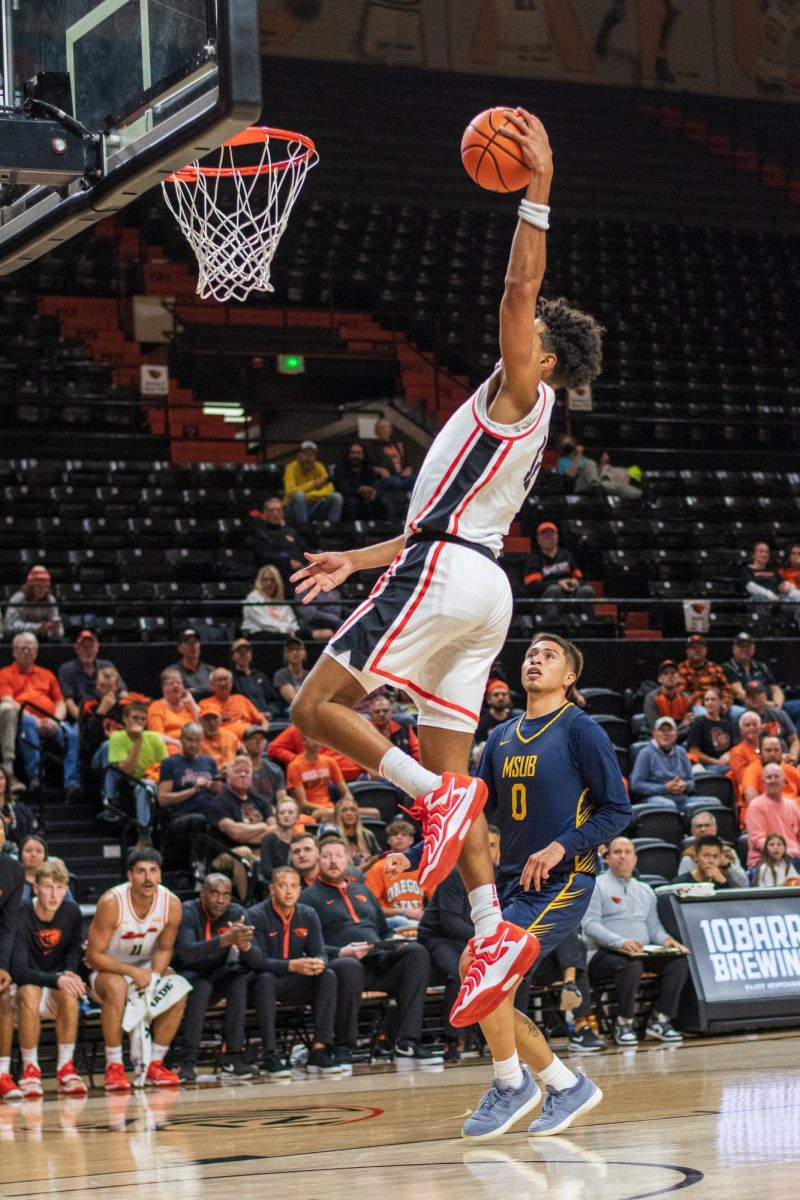 Forward Michael Rataj goes up for a basket against the Montana State Billings Yellow Jackets on October 26.