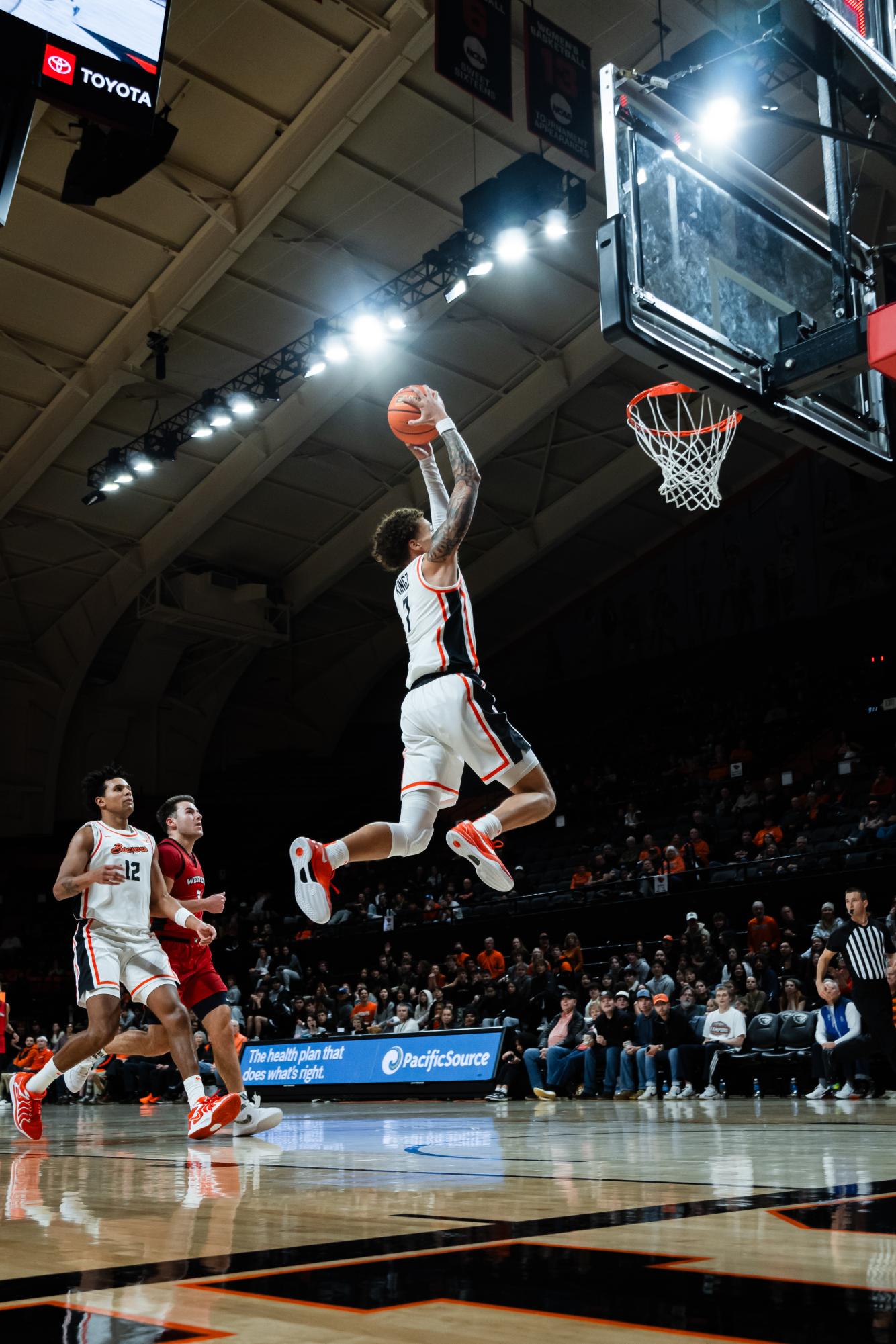 Josiah Lake II puts an emphasis on his slam dunk against Western Oregon University at Gill Coliseum on Nov 12 2024.