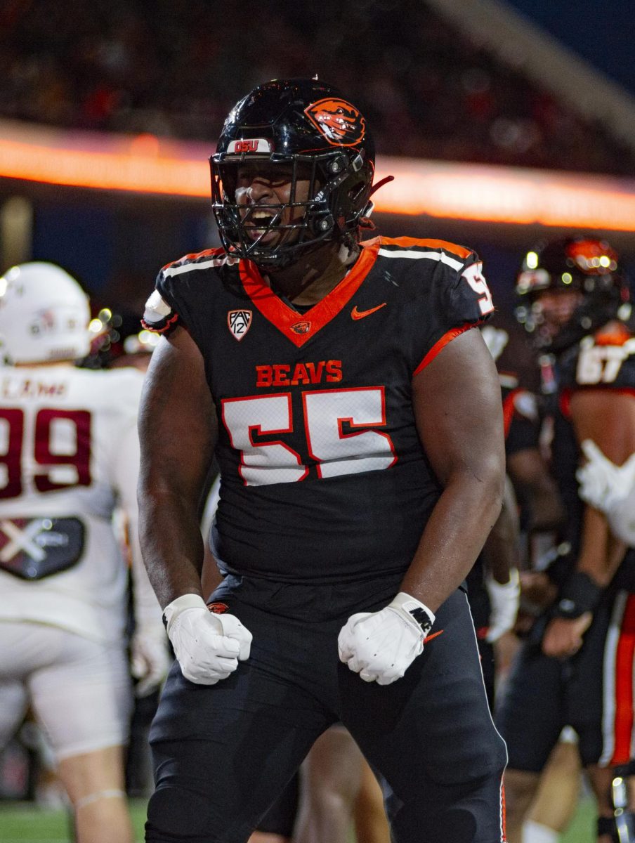 Offensive Lineman Van Wells flexes for the Beaver home crowd following a touchdown against Washington State at Reser Stadium on Nov 23. Wells and the Beaver O-line led the rushing attack to 170 yards and 3 touchdowns in the win against the Cougars